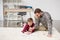 Businessman freelancer drawing with son