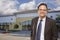 Businessman In Front of Vacant Office Building.