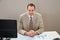 Businessman with gantt chart sitting at desk