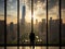 Businessman gazing out skyscraper window