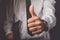 Businessman gesturing thumbs up sign