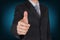 Businessman give a thumbs up for compliment as praise, congratulate, good and like concept