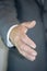 Businessman giving hand