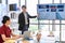 Businessman Giving Presentation Report to Business Team in the Conference Room, Shows Digital Information Graphics, Pie Charts