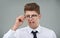 Businessman, glasses and disgust in studio for optical healthcare, omg and overwhelmed on gray backdrop. Male person