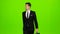 Businessman goes to work, with a diplomat he waves his hand to others. Green screen