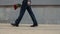 Businessman going on date outdoor. Man carrying flowers at stree