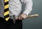 Businessman with hammer in hand and working zone black and yellow stripes cravat