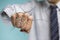 Businessman hand hitting the transparent glass with cracked