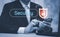 Businessman hand holding mobile phone, Digital Composite Image Of user Using Laptop With, cyber security concept, data protection