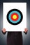 Businessman Hand Holding Poster with Target