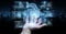 Businessman hand holding and touching wireframe holographic digital projection of an engine 3D rendering