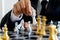 Businessman hand move one gold King chess to force to silver chess falling