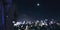 Businessman hand in pocket with defocused city at night background