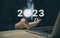 Businessman hand showing 2023. Investment startup concept.