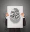 Businessman hand showing poster of 3d metal human brain