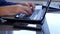 Businessman Hands Accessing Online Data Base Using a Laptop