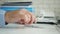 Businessman hands image in office playing restless with a pen on the table