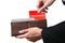 Businessman hands pulling red folder COMMISSION concept on brown