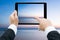 Businessman hands tablet taking pictures beach and sea