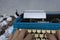 Businessman hands typing on an old typewriter and trash paper background.