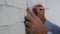 Businessman Hands Writing On the Office Wall using a page and a Pencil