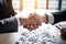 Businessman handshake for the teamwork of business merger and acquisition, AI Generative