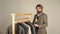 Businessman handsome guy in clothes shop choosing garments, menswear concept