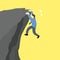 Businessman is hanging and try to climb on the edge of a cliff.