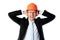 Businessman in helmet covering his ears