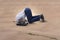 The businessman hiding his head in sand escaping from problems