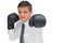 Businessman hitting with black boxing gloves