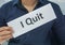 Businessman hold paper sheet of I quit as resignation letter from the office