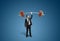 Businessman holding barbell