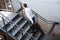 Businessman holding briefcase and climbing staircase