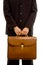 Businessman holding brown briefcase