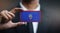 Businessman Holding Card of Guam Flag