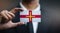 Businessman Holding Card of Guernsey Flag