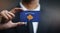 Businessman Holding Card of Kosovo Flag