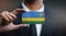 Businessman Holding Card Rwanda Flag