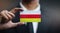 Businessman Holding Card of South Ossetia Flag