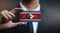 Businessman Holding Card of Swaziland Flag