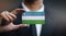 Businessman Holding Card of Uzbekistan Flag