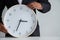 Businessman holding a clock ready to work  Strategy and time management in the office,  Concept: symbol manage at deadline profess