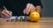 Businessman holding a coin in a piggy bank. money growth and saving money.