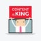 Businessman holding Content is King sign in computer notebook