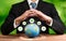 Businessman holding Earth with eco friendly icon design. Reliance