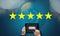 Businessman holding five star rating,Review, increase rating or