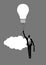 Businessman holding a floating light bulb