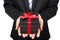 Businessman holding a gift